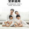 A family of four smiling while sitting together on a sofa, demonstrating the use of high-strength ant bait for home and garde