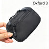 A hand holds a black Oxford 3 utility pouch, a compact EDC item made with premium materials.