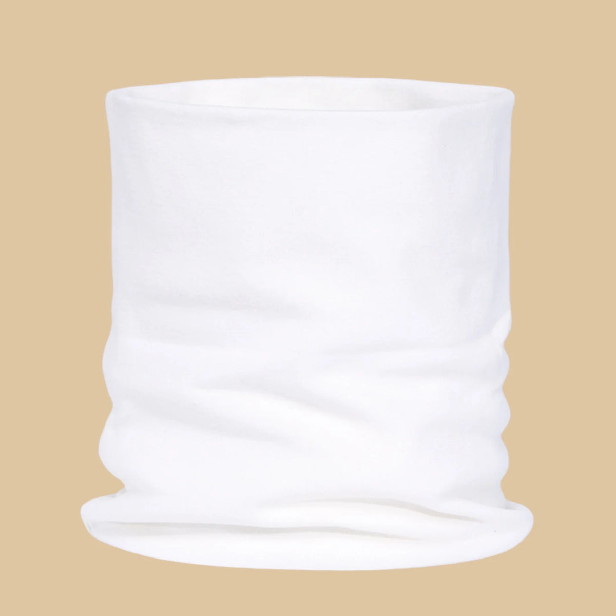 A rolled white cozy cotton blend neck warmer scarf displayed against a beige background.