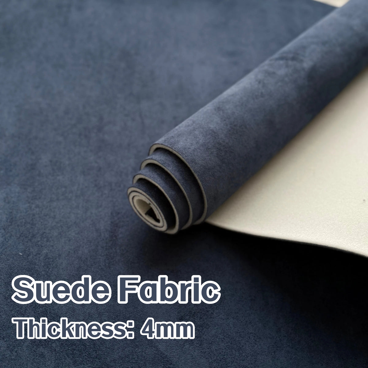 Roll of dark gray suede fabric with a light-colored backing, showing the thickness of 4mm.