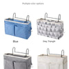 Four hanging bedside storage organizers in blue, grey triangle, grey, and white colors.
