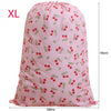 Pink XL drawstring laundry bag with a small red and green berry pattern