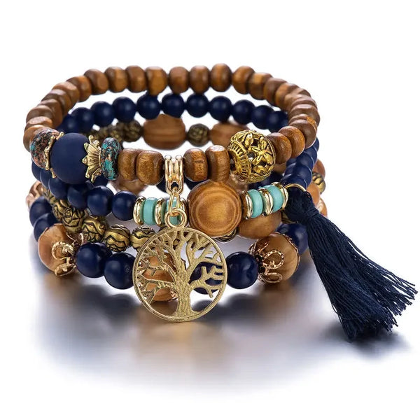 A set of stacked wooden and blue beads with gold accents forming a Boho Tree of Life bracelet.