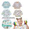 A collection of kids waterproof long sleeve art smocks and feeding bibs featuring various animal and nature patterns.