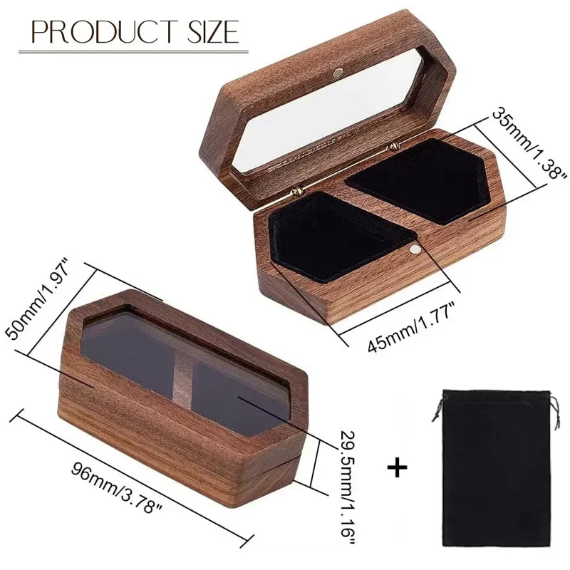 A wooden ring box with a lid and an open view showing two compartments, next to a black velvet pouch.