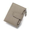 A beige genuine leather RFID blocking bifold wallet shown from above.