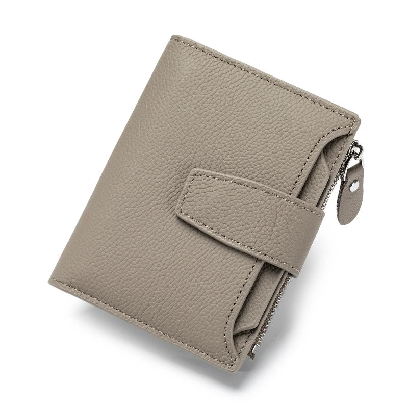 A beige genuine leather RFID blocking bifold wallet shown from above.