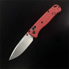 A folding pocket knife with a pink handle and silver blade is shown in profile against a black background.