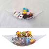 A large mesh toy storage hammock filled with various plush toys and stuffed animals.