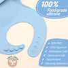 Light blue silicone baby bib with a food catcher pocket, highlighting food grade and safety features.