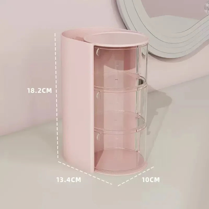 A pink clear acrylic hair accessories organizer with rotating compartments shown on a white surface.