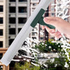 A hand is using a silicone scraper broom and squeegee to clean glass, creating water droplets.