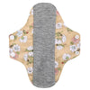 Reusable cotton menstrual pads featuring a beige floral pattern on the outer layer and a gray absorbent core.