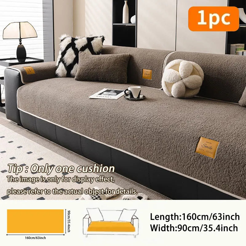 A cozy anti-slip lamb fleece sofa mat in brown and cream colors shown on a sofa.