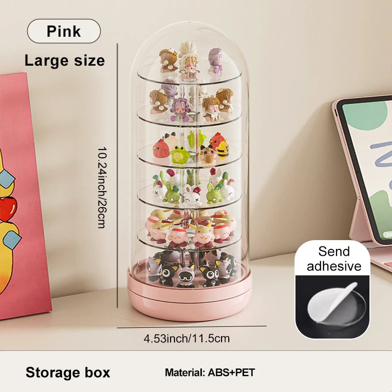 A pink rotating transparent display box filled with small collectible figures and animals.