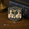 A gold-colored enamel lapel pin featuring the U.S. Navy 250th Anniversary design with an American eagle and naval insignia.