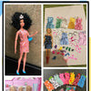 A collection of 42 doll fashion accessories including dresses, hair, and makeup for 1/6 scale dolls.