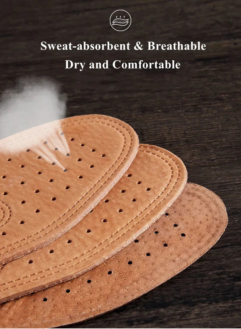 Three brown genuine leather insoles are shown on a dark wooden surface, emphasizing their breathable and comfortable features