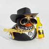 A black cowboy hat with gold accents and a rubber duck ornament featuring a gold-plated gun.