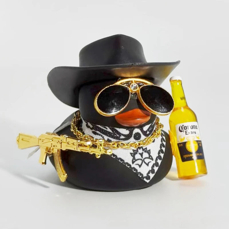 A black cowboy hat with gold accents and a rubber duck ornament featuring a gold-plated gun.