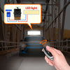 A hand holds a black wireless remote control switch for a 12-72V DC relay, demonstrating its use in a vehicle context.