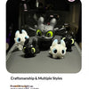 A collection of black and white Toothless-inspired charms with glowing eyes and movable wings displayed on a dark surface.