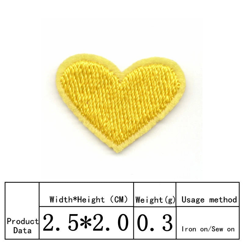 A yellow heart shaped embroidery patch with a textured surface.