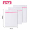 Three white mesh laundry bags with pink trim are displayed side by side.