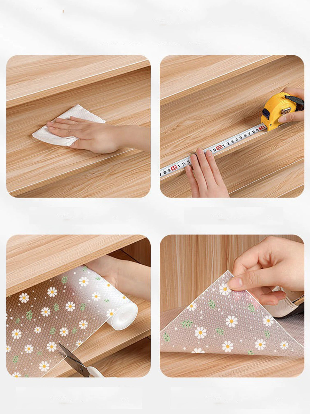 A hand is using a plastic mat with daisy flowers to wipe a wooden kitchen drawer.