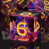 A close-up of a purple resin polyhedral die with the number 6, reflecting light on a dark surface.