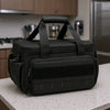 A black 14-inch heavy duty tool bag with padded compartments and carrying handles resting on a light surface.