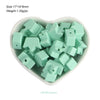A pile of mint green silicone crown star heart beads for DIY jewelry making