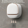 A white wall-mounted soap holder with a lid is installed on a gray marble surface, showing the adhesive patch for installatio