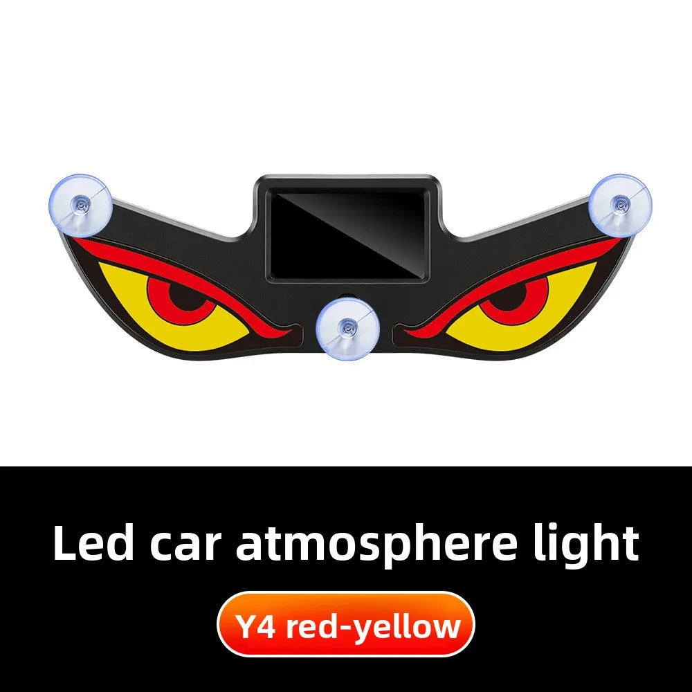 A black demon eye window decal with yellow and red accents and clear lenses for car atmosphere lighting.