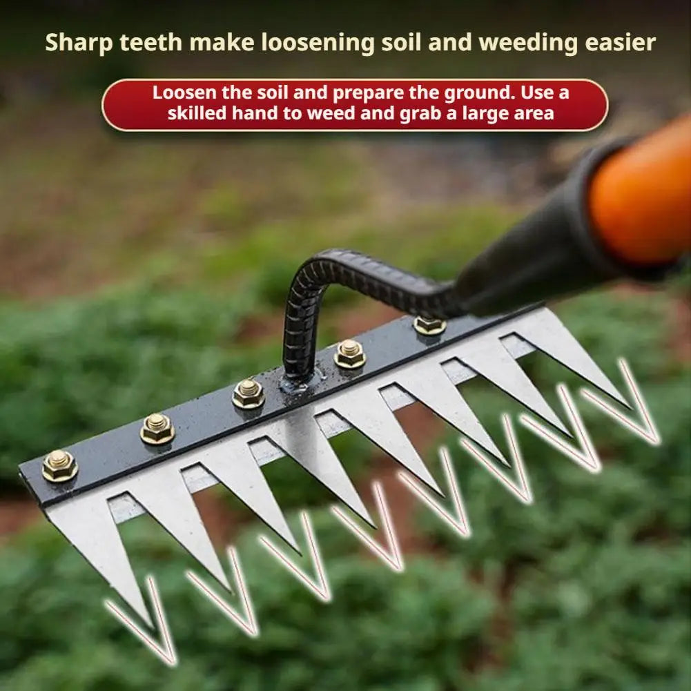 A close-up of a carbon steel garden weeding rake with sharp tines and an ergonomic handle being used to loosen soil.
