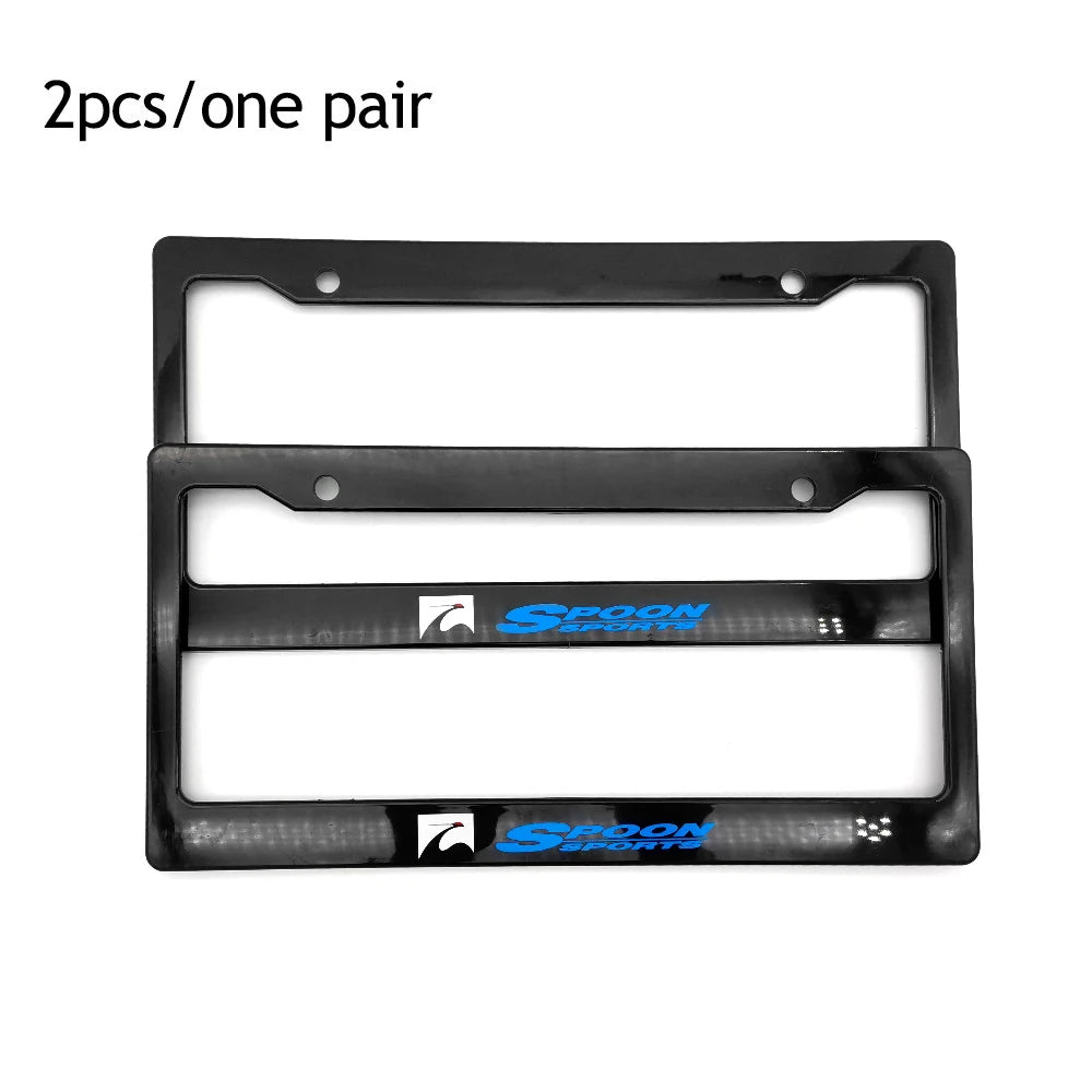 A pair of black racing style license plate frames with a JDM aesthetic.