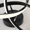 A modern black LED ceiling light fixture with a curved white light element and a touch switch.
