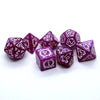 A set of purple dragon-embellished polyhedral dice for tabletop role-playing games