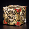 A premium metal spinner dice cube for D&D featuring a gold and red design with various numbered faces.