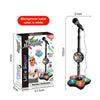 A white microphone cable is shown next to a box for a kid star microphone stand with a built-in speaker.