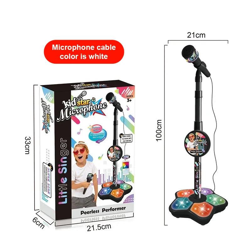 A white microphone cable is shown next to a box for a kid star microphone stand with a built-in speaker.