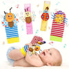 A set of soft teether booties and sensory toys for babies, featuring colorful patterns and musical elements.
