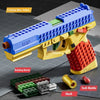 A yellow and blue building block toy pistol with a red shell, showing the weapon and components.