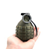 A hand holds a universal 50mm tow ball cover protector, which is a dark olive green, conical object with a silver loop on top