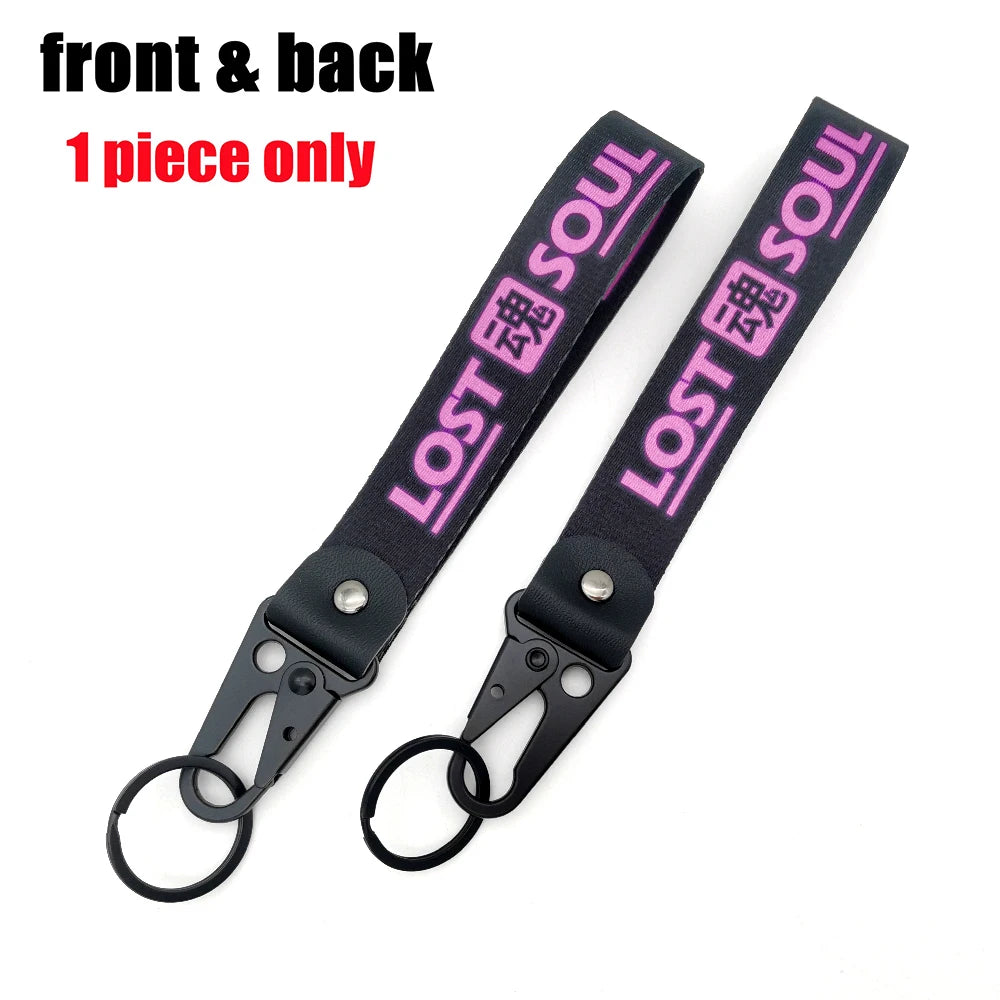 A black lanyard with pink text Lost Soul and a steel clip attached, shown from the front and back.