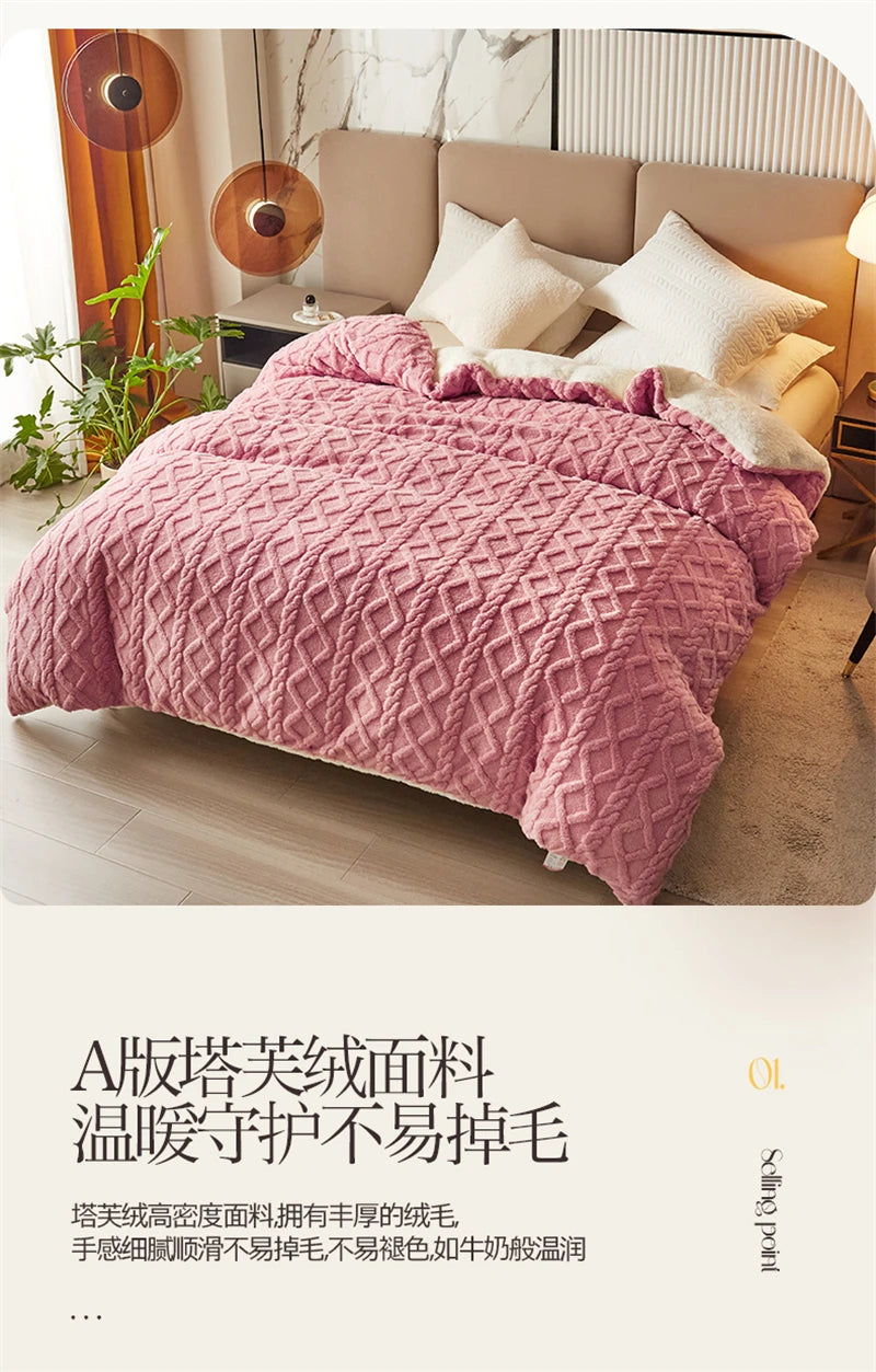 Pink quilted velvet duvet cover and blanket displayed on a bed in a bright room.