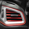 Close-up of flexible car interior trim strips featuring a silver surround and red accent lines.