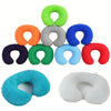 A collection of inflatable U-shaped travel neck pillows in various colors including green, orange, blue, red, and light blue/