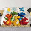 A colorful throw blanket featuring five cartoon dinosaurs and a sunny sky design.