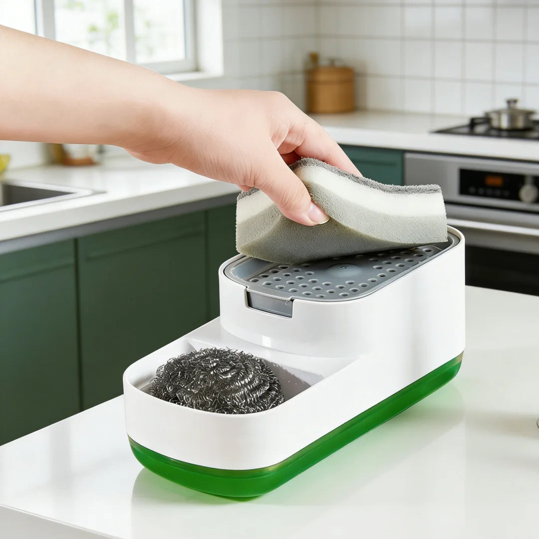 A hand is placing a sponge into the dispenser of a white countertop soap dispenser with a built-in sponge holder.